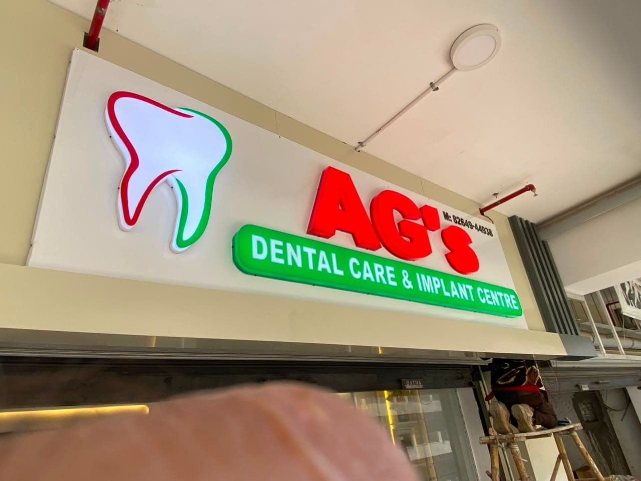 AG's Dental Care clinic LED acrylic glow sign board made by Pen to Print Advertisers, Punjab