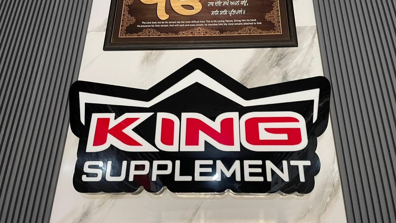 Royal Palm backlit round logo sign board installed by Pen to Print Advertisers